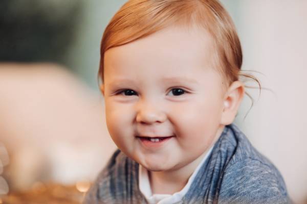 adorable-baby-boy-smiling-camera-blurred-background (1)